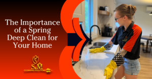left side of graphic is black faded to red with white text that reads "The Importance of a Spring Deep Clean for Your Home" The right side of the graphic has a woman in a kitchen cleaning the counter tops